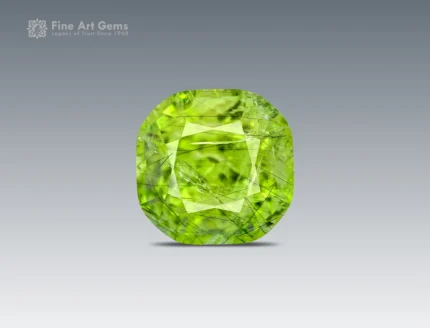 4.35 carat cushion-cut apple green Peridot with Ludwigite inclusions from Pakistan