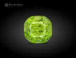 4.35 carat cushion-cut apple green Peridot with Ludwigite inclusions from Pakistan