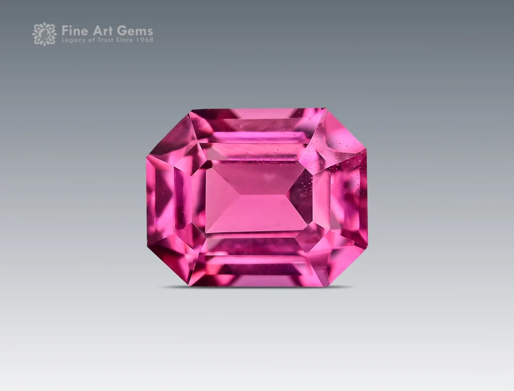 0.75 carat emerald cut rhodolite garnet from Africa with raspberry pink color