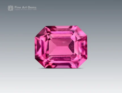 0.75 carat emerald cut rhodolite garnet from Africa with raspberry pink color
