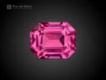 0.75 carat emerald cut rhodolite garnet from Africa with raspberry pink color