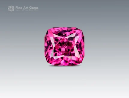 Eye-clean 1.05 carat cushion cut rhodolite garnet displaying vivid raspberry pink color and excellent brilliance from Africa.