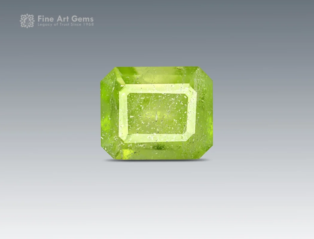 Natural 1.70 carat emerald-cut peridot gemstone with vibrant lime-green color and natural inclusions from Pakistan.