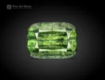 7 carat cushion cut green peridot with ludwigite inclusions from Pakistan